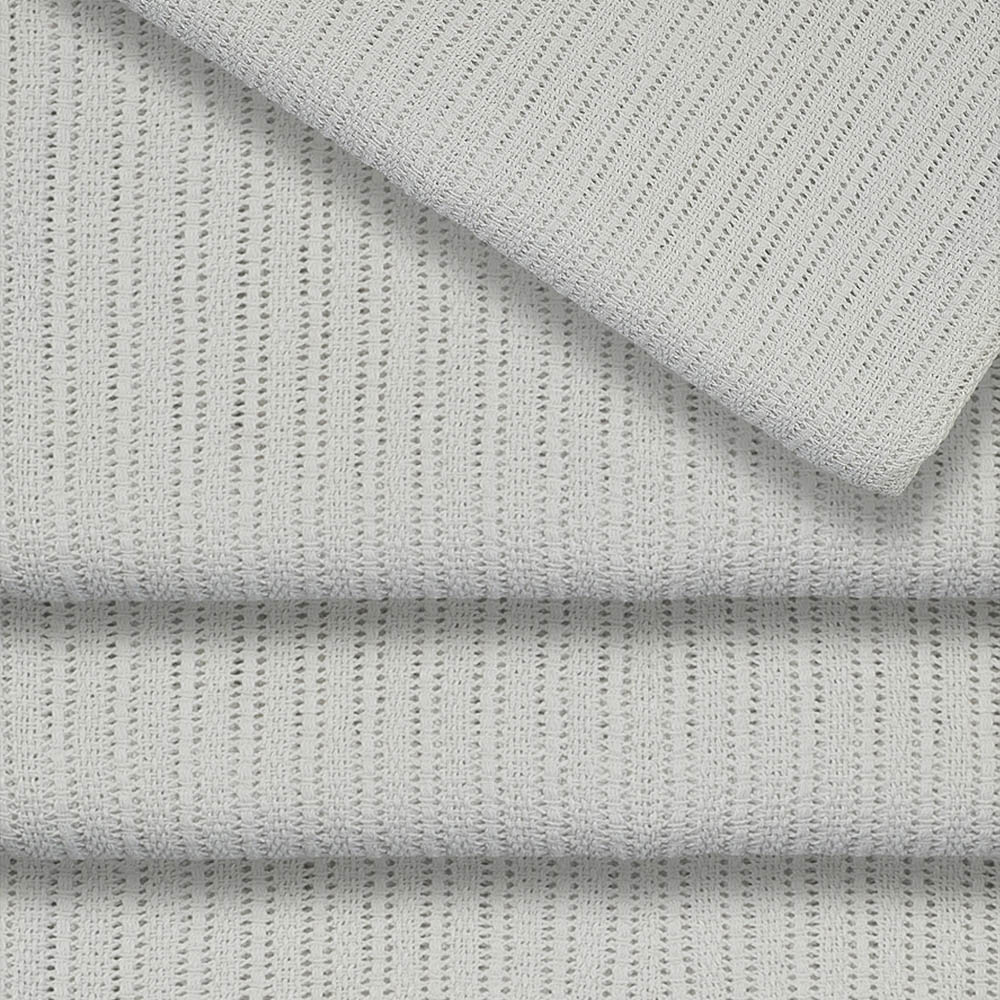 Stack of folded thermal blankets in assorted colours