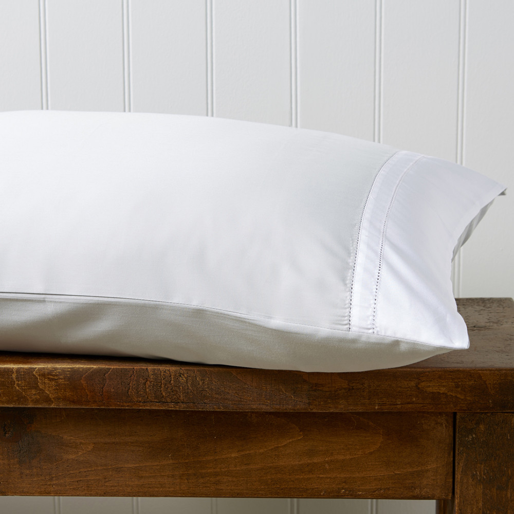 Hospitality-grade bedsheets folded for contract supply