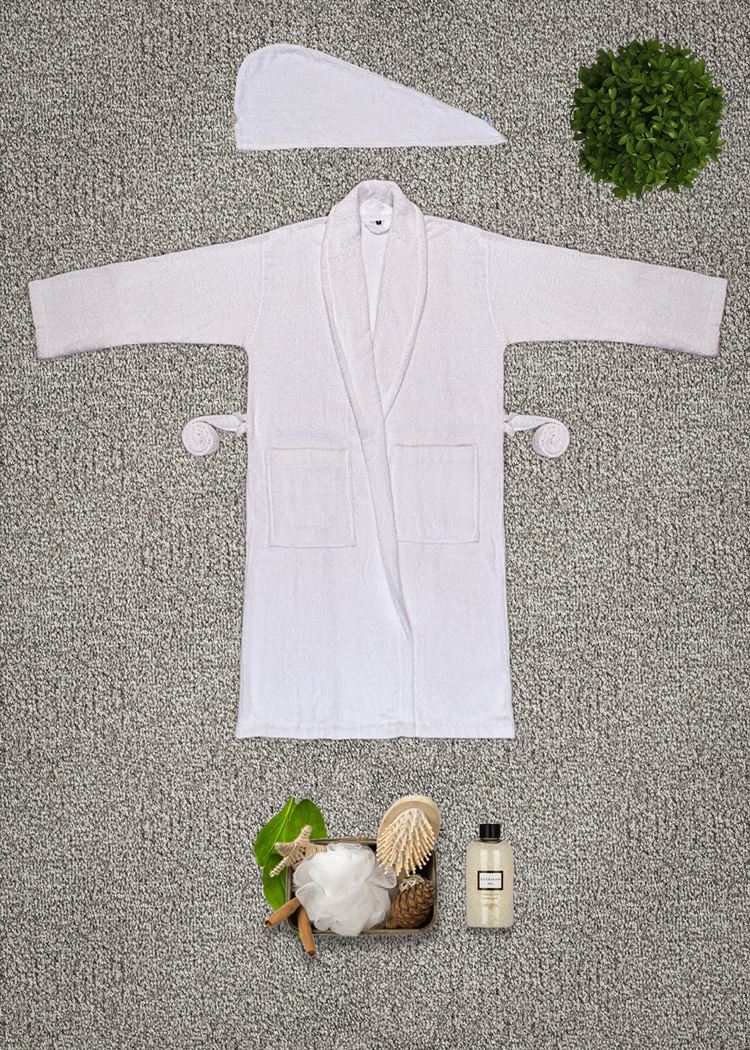 Terry bathrobe styled on a hanger with belt