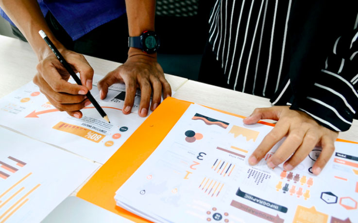Team reviewing product design charts together