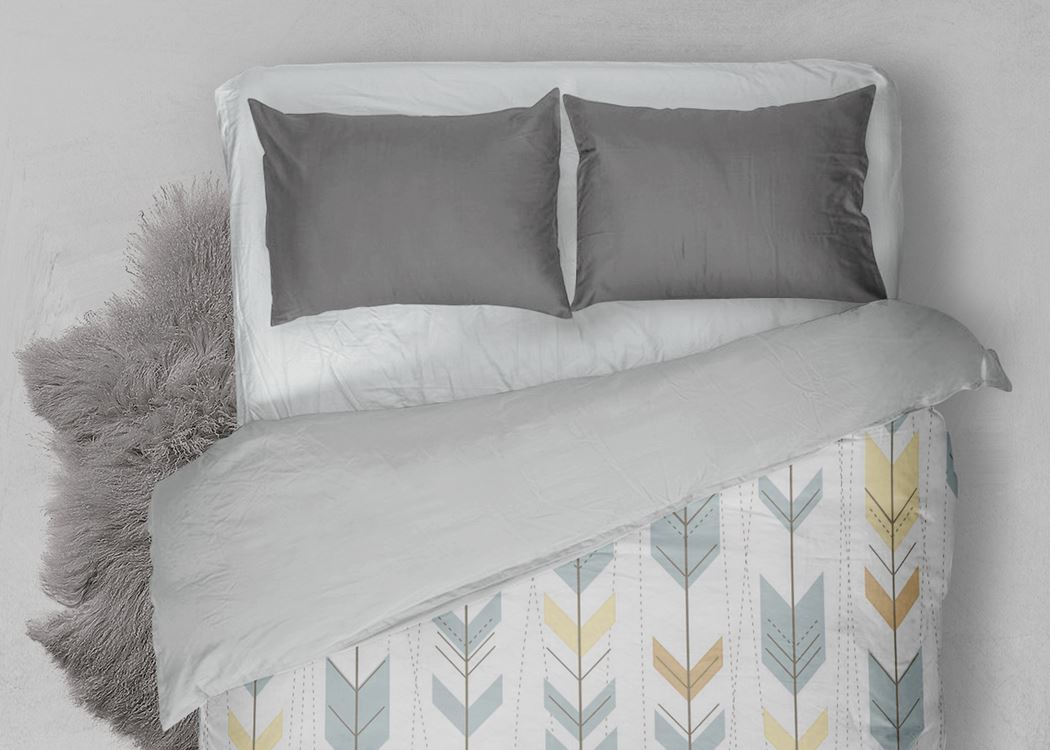 Grey pillow covers on a hotel bed