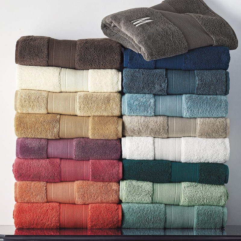 Stacks of terry bath towels in a full colour range