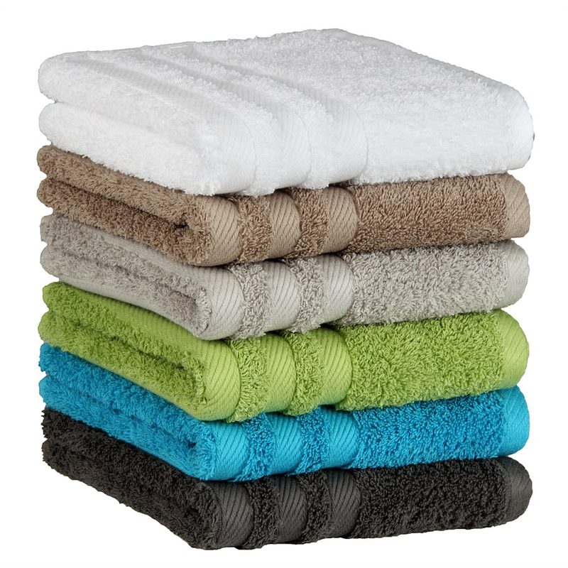Stack of terry hand towels in white, taupe, green, turquoise and grey