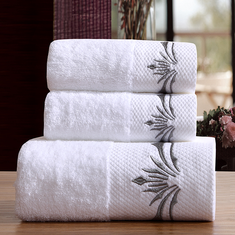 White hotel terry towel set with silver embroidery